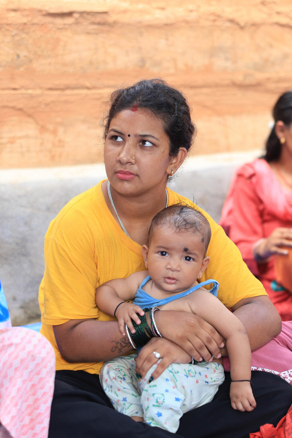 © UNICEF/UNI645588/Laxmi-Prasad-Ngakhusi On 24 July 2024, Ms. Alice Akunga, UNICEF Representative to Nepal, visited a mothers' group in Rawat Gaun, Jajarkot District, where she met with pregnant and nursing mothers, including Indu Nepali, who was guided by a Female Community Health Volunteer (FCHV).